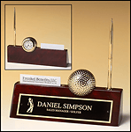 Goldtone metal golfball/clock on rosewood piano-finished nameplate with business card holder and pen