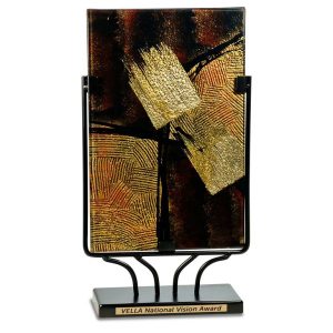 Art glass award on black stand