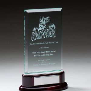 Jaded glass award on piano finished rosewood base