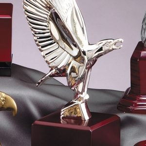 Nickel plated American eagle on rosewood base