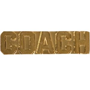 "Coach" pin with bright gold finish and butterfly clutch back. Pin length is 0.5''